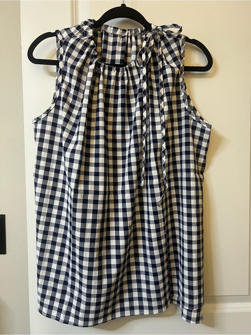 Navy/white checked sleeveless top with tie neck. 4X fits like 2X.
